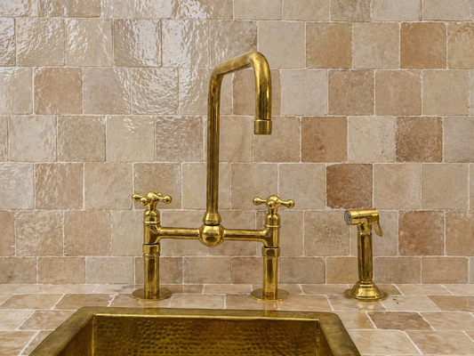 8-inch unlacquered brass bridge kitchen faucet with cross handles, square swivel spout and side sprayer