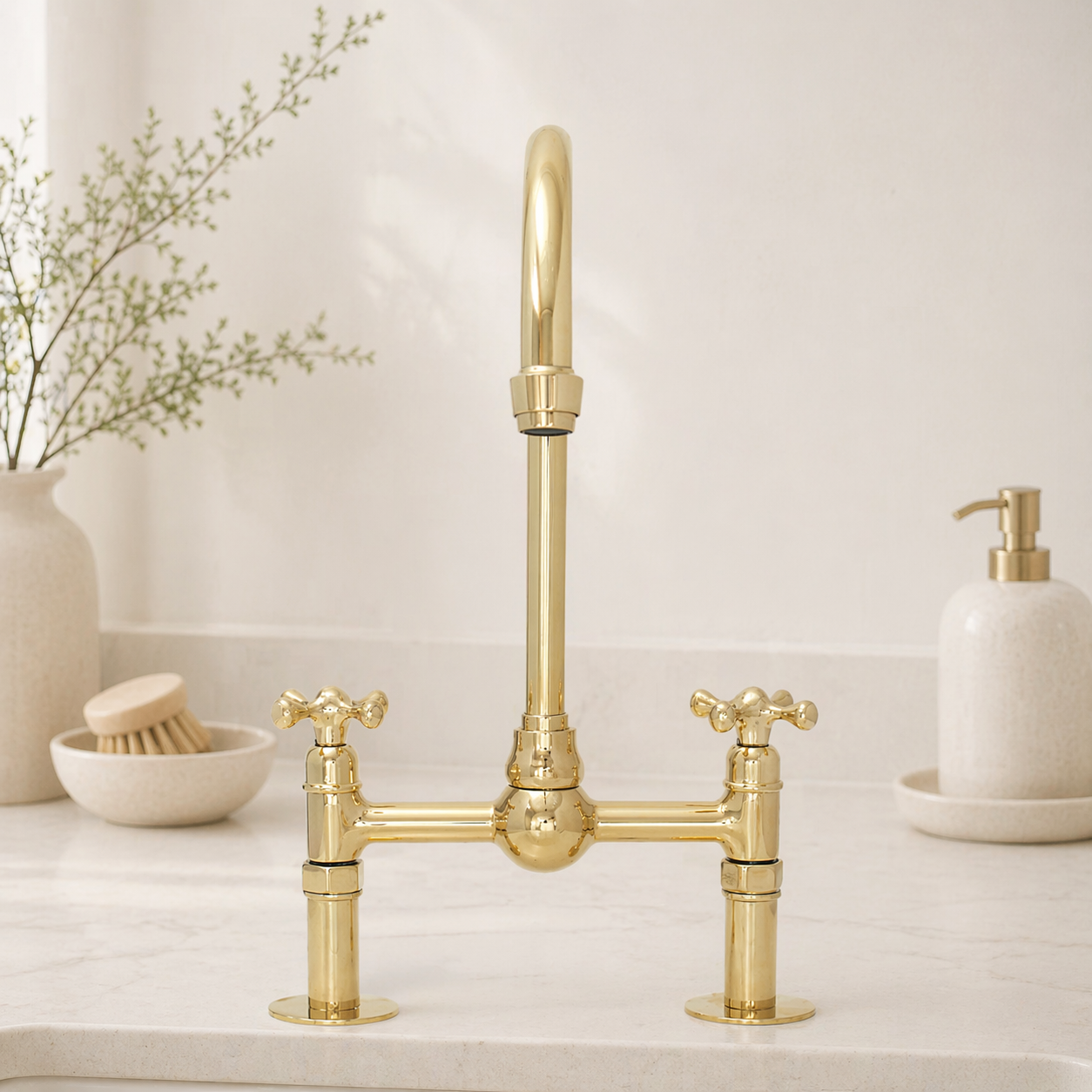 Front view of unlacquered brass bridge kitchen faucet with high-arc spout and cross handles