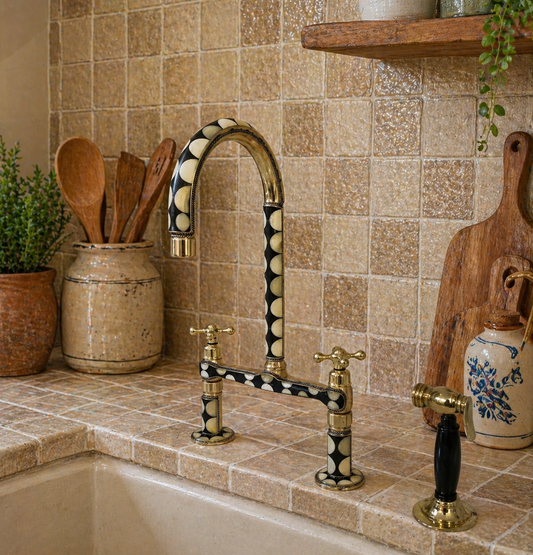 Handmade brass bridge kitchen faucet with black and bone resin accents and matching side sprayer