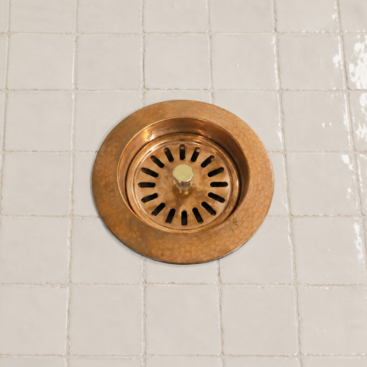 Handmade solid copper kitchen sink strainer basket drain assembly with removable basket for farmhouse and copper kitchen sinks.