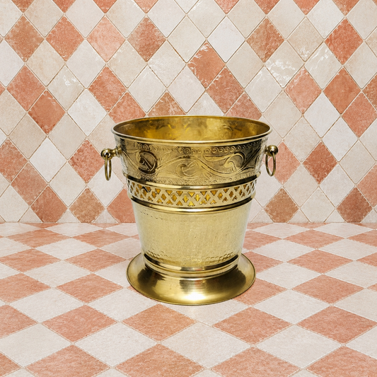 Handmade unlacquered solid brass Moroccan wastebasket with engraved decorative details and side ring handles.