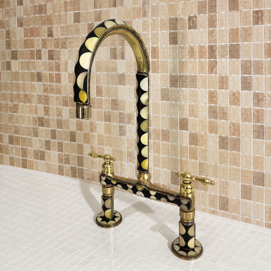 Moroccan brass bridge kitchen faucet with bone and black resin inlay, linear legs and lever handles